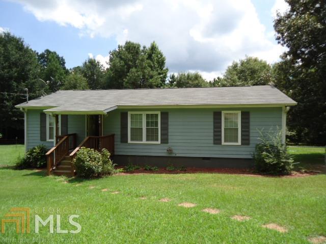 883 Pete Davis Road Newnan, GA 30263 - Photo 1 of 1 a view of a house with a garden