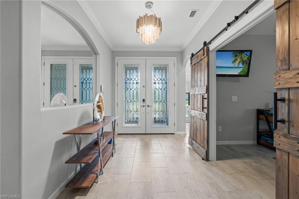 19656 The Pl Boulevard Estero, FL 33928 - Photo 11 of 42 a view of a livingroom with furniture and entryway livingroom