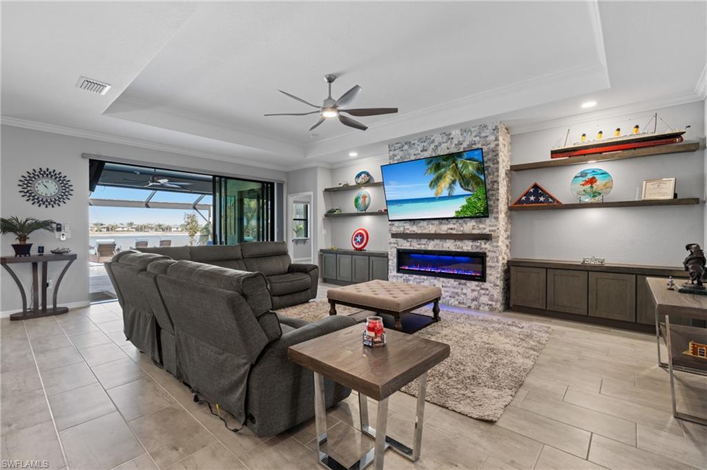 19656 The Pl Boulevard Estero, FL 33928 - Photo 13 of 42 a living room with furniture and a flat screen tv