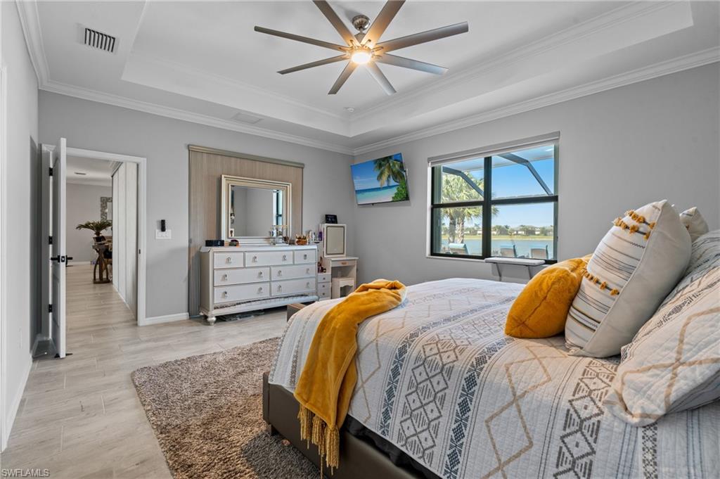 19656 The Pl Boulevard Estero, FL 33928 - Photo 19 of 42 a bedroom with a large bed and a window