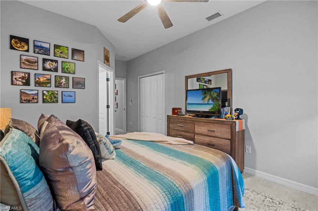 19656 The Pl Boulevard Estero, FL 33928 - Photo 24 of 42 a bedroom with a bed and a window