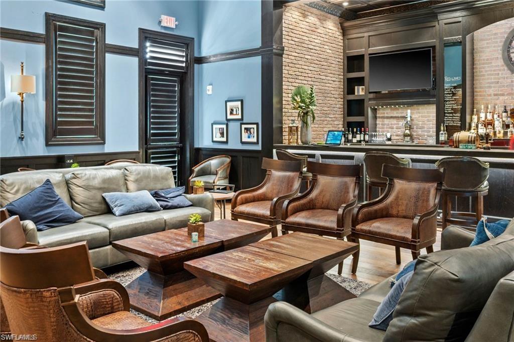 19656 The Pl Boulevard Estero, FL 33928 - Photo 36 of 42 a living room with furniture and a large window