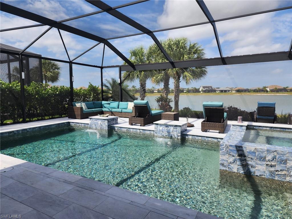 19656 The Pl Boulevard Estero, FL 33928 - Photo 8 of 42 a living room with couch and outdoor view