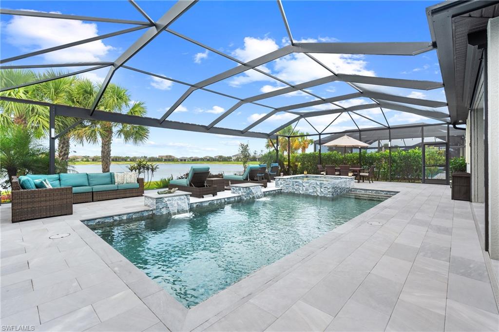 19656 The Pl Boulevard Estero, FL 33928 - Photo 9 of 42 a view of a swimming pool with a patio