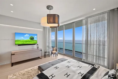a room with furniture and a large window