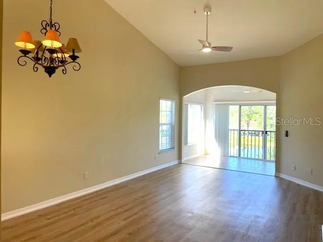 a view of a room with wooden floor