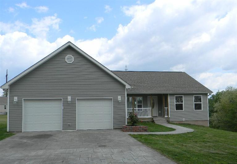 1226 Adams Road Corbin, KY 40701 - Photo 1 of 21 The covered patio with decorative stampe