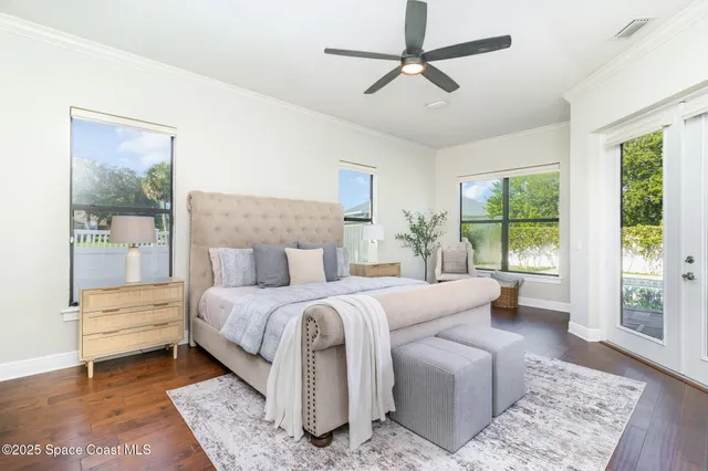 a bedroom with a bed a couch and a window