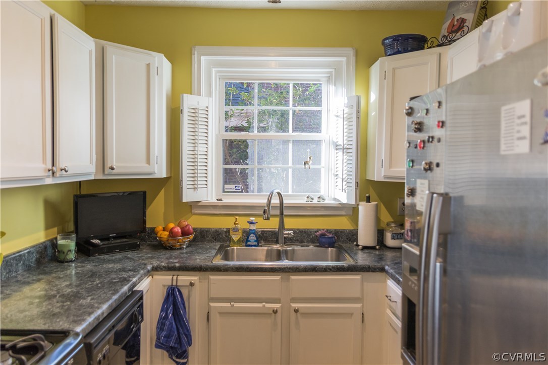 5109 Sylvan Road Richmond, VA 23225 - Photo 8 of 27 Updated white kitchen with tile floor and all appl