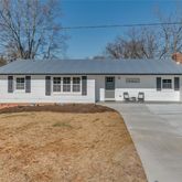 a front view of a house with yard