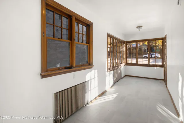a view of a hallway with windows