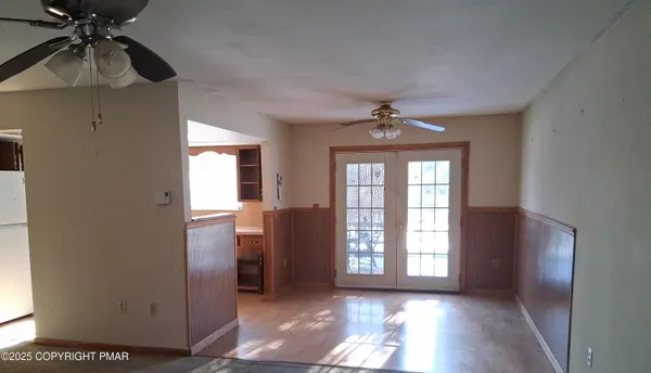 a view of empty room with windows