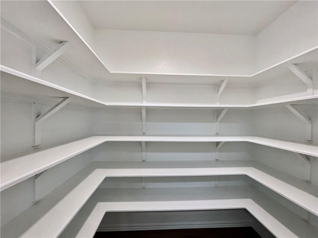 126 Canley Loop Hutto, TX 78634 - Photo 14 of 24 a view of a room with shelves