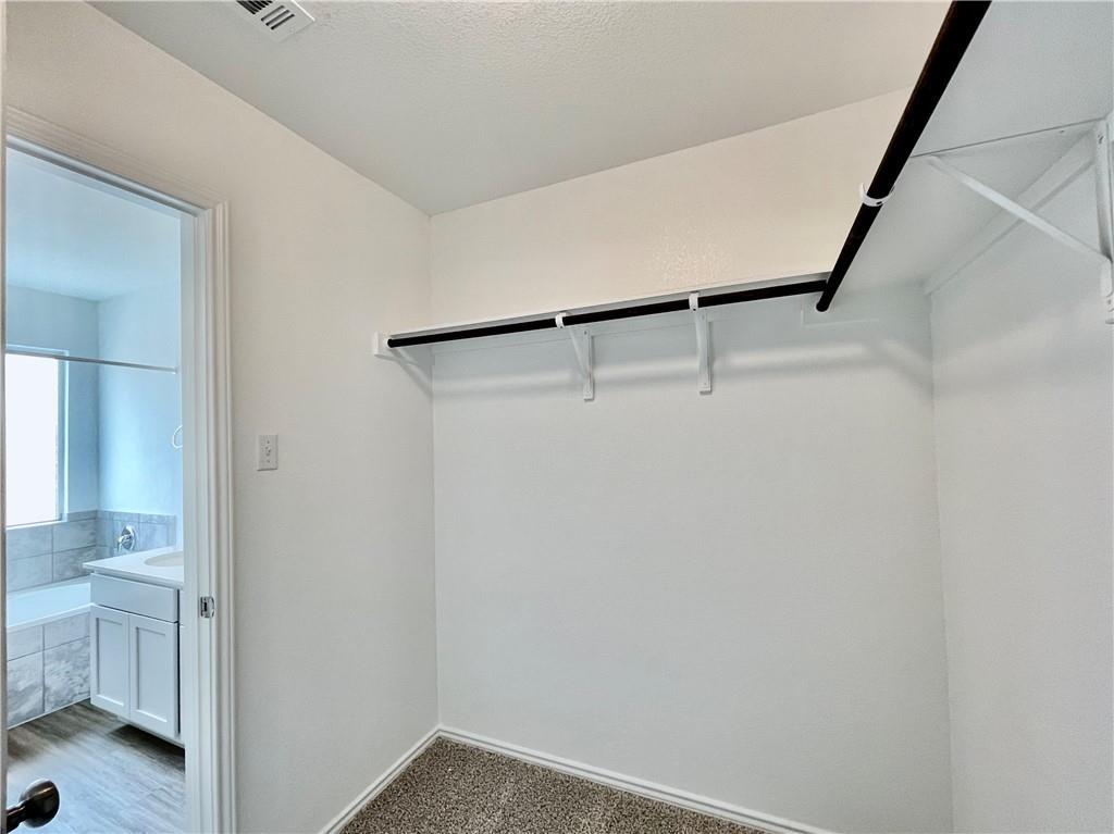 126 Canley Loop Hutto, TX 78634 - Photo 19 of 24 a view of small space with wooden floor