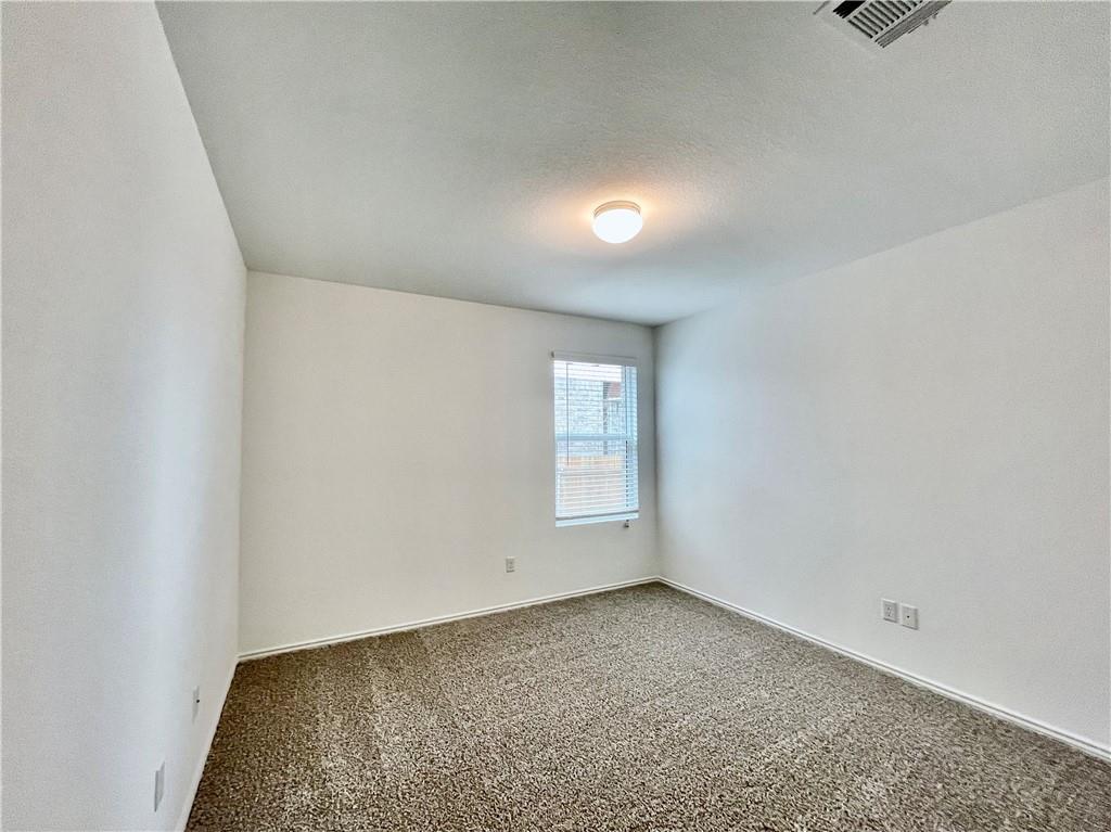126 Canley Loop Hutto, TX 78634 - Photo 20 of 24 an empty room with a empty space and window