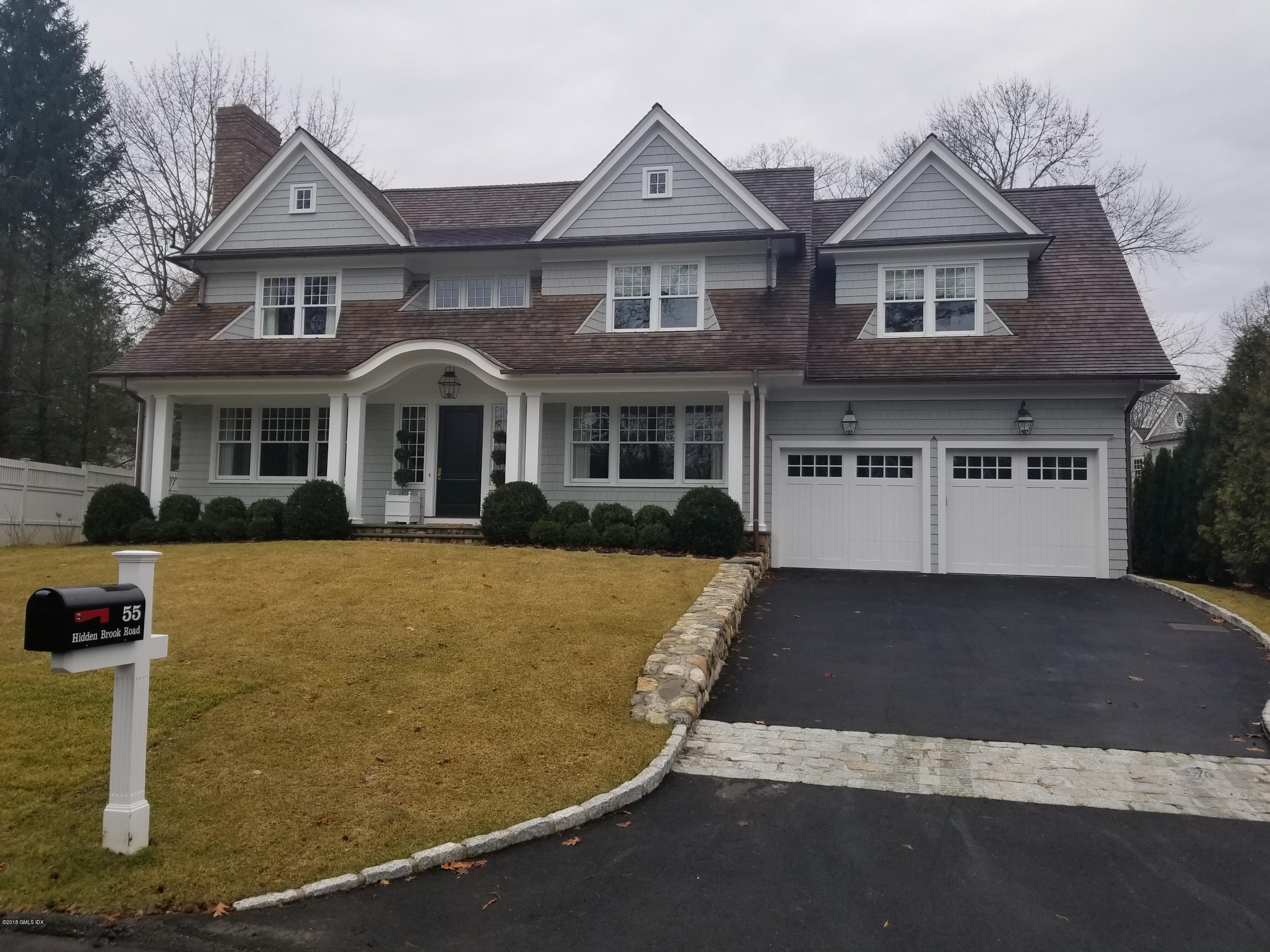 55 Hidden Brook Road Riverside, CT 06878 - Photo 1 of 2 a front view of a house with a yard