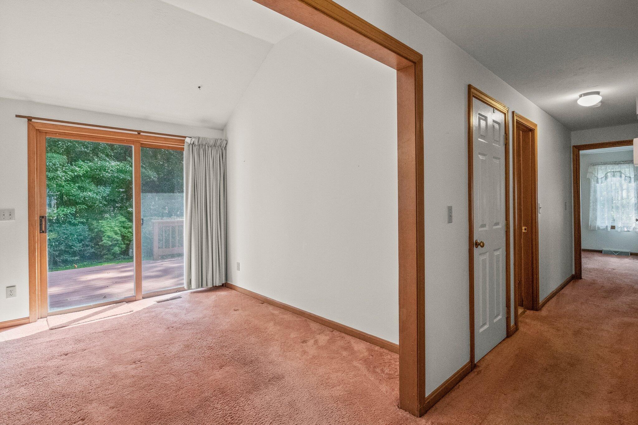 64 Eisenhower Drive Cotuit, MA 02635 - Photo 13 of 67 Living room view to hall and dining room