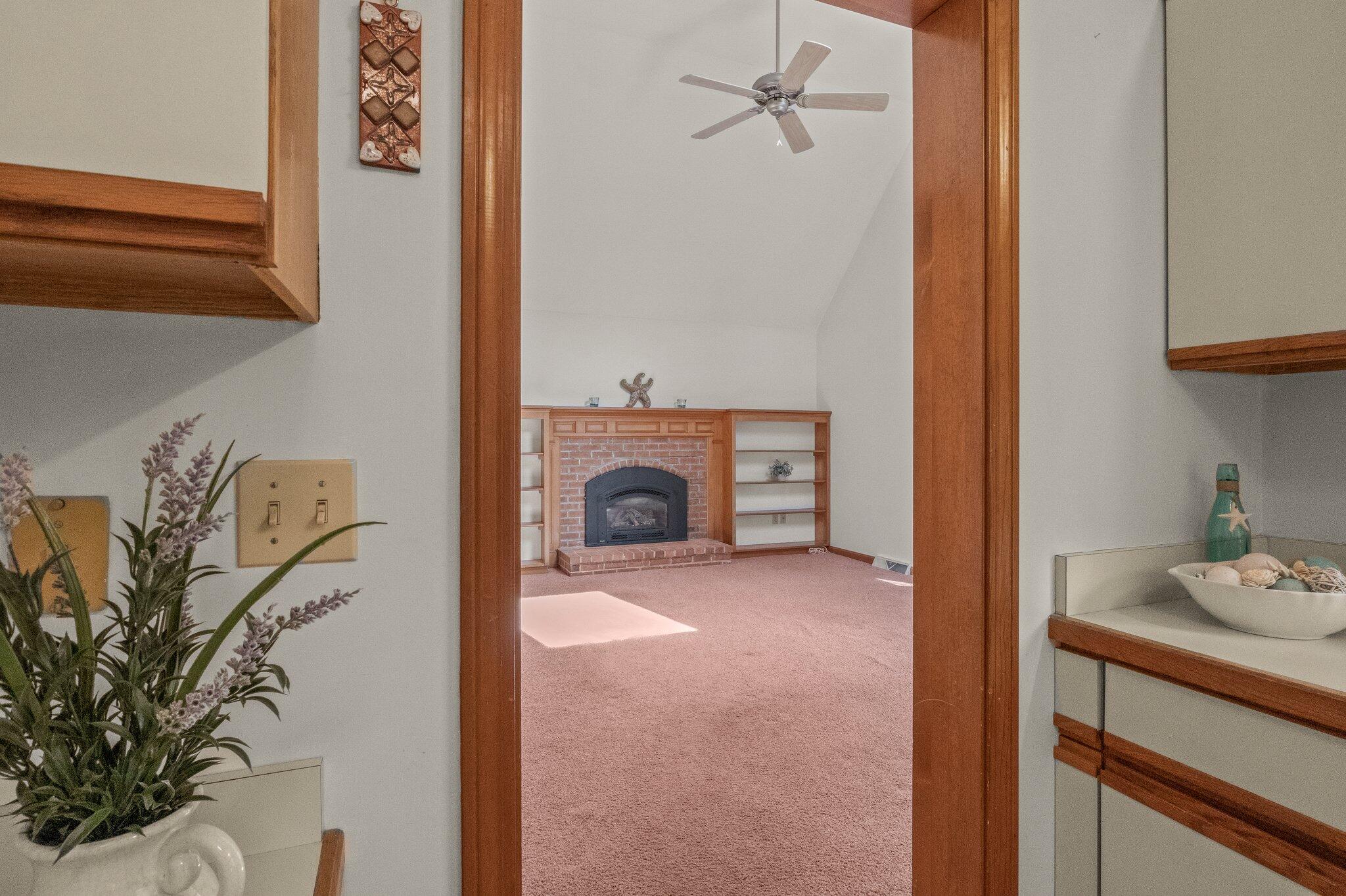 64 Eisenhower Drive Cotuit, MA 02635 - Photo 21 of 67 Peek of family room off kitchen