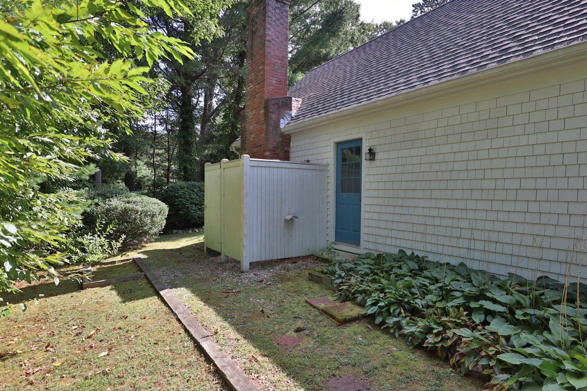 64 Eisenhower Drive Cotuit, MA 02635 - Photo 60 of 67 Side yard ~ outdoor shower