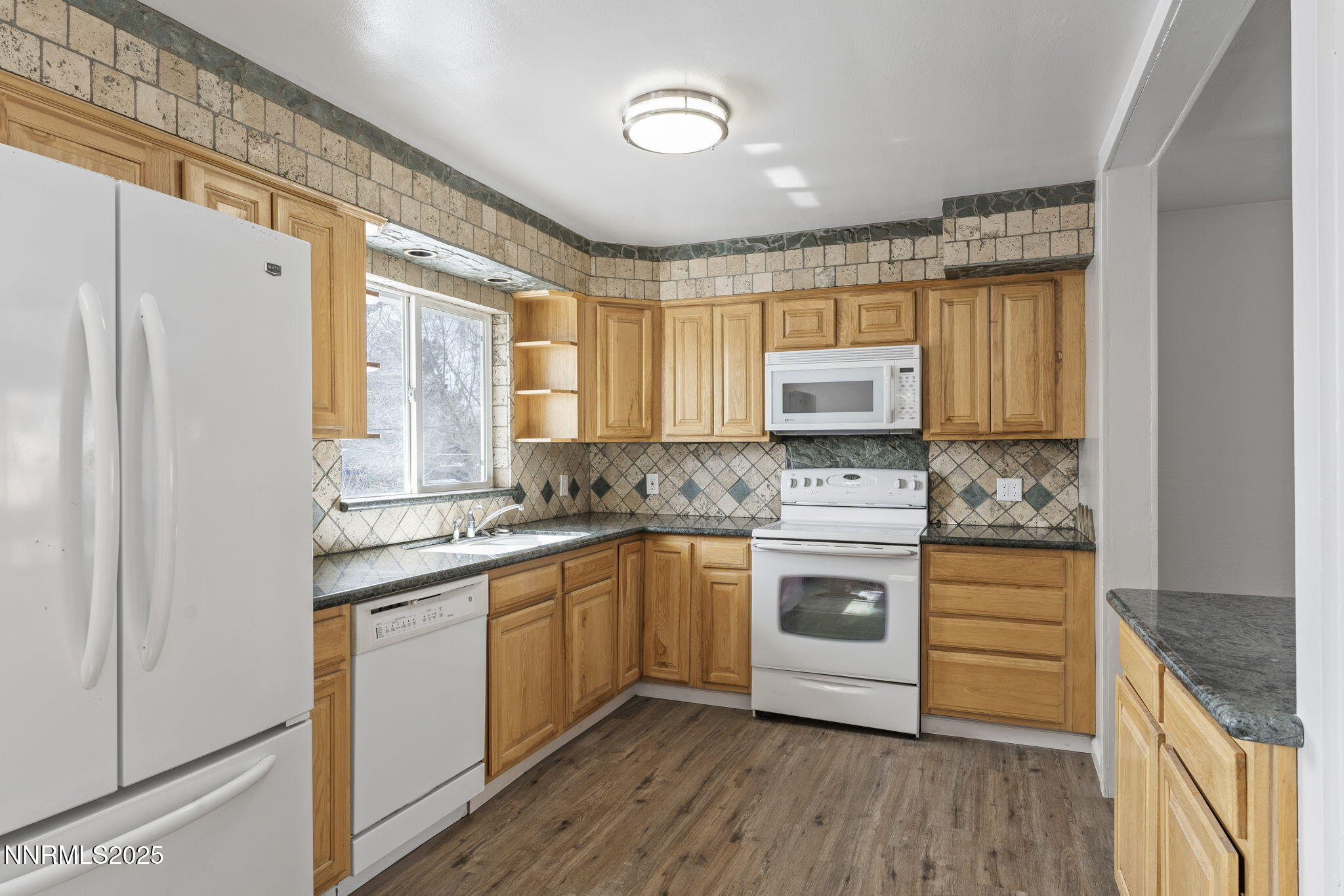 840 Brookfield Drive Reno, NV 89503 - Photo 13 of 42 a kitchen with stainless steel appliances granite countertop a stove and a refrigerator