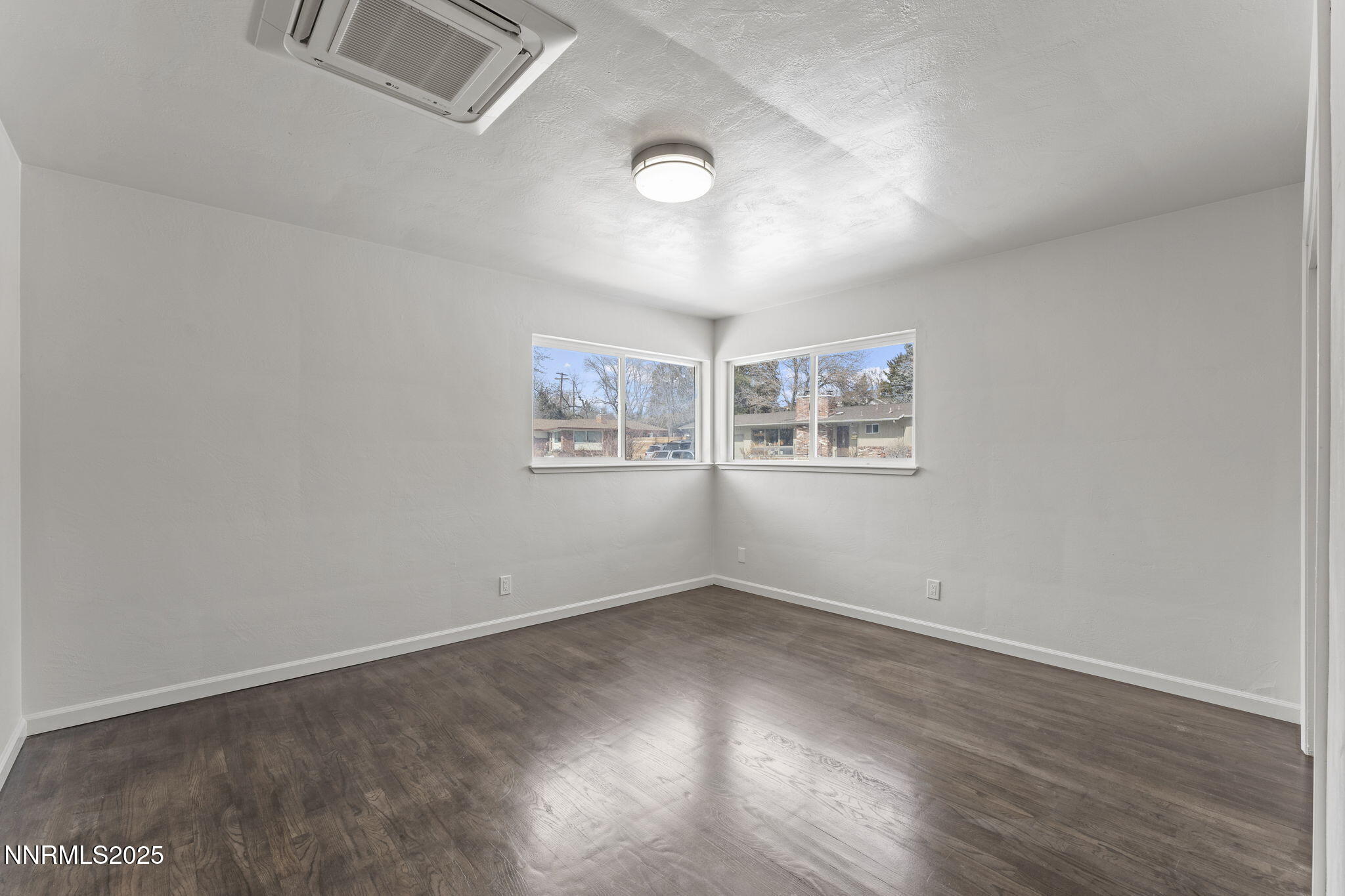 840 Brookfield Drive Reno, NV 89503 - Photo 17 of 42 a view of a big room with wooden floor and windows