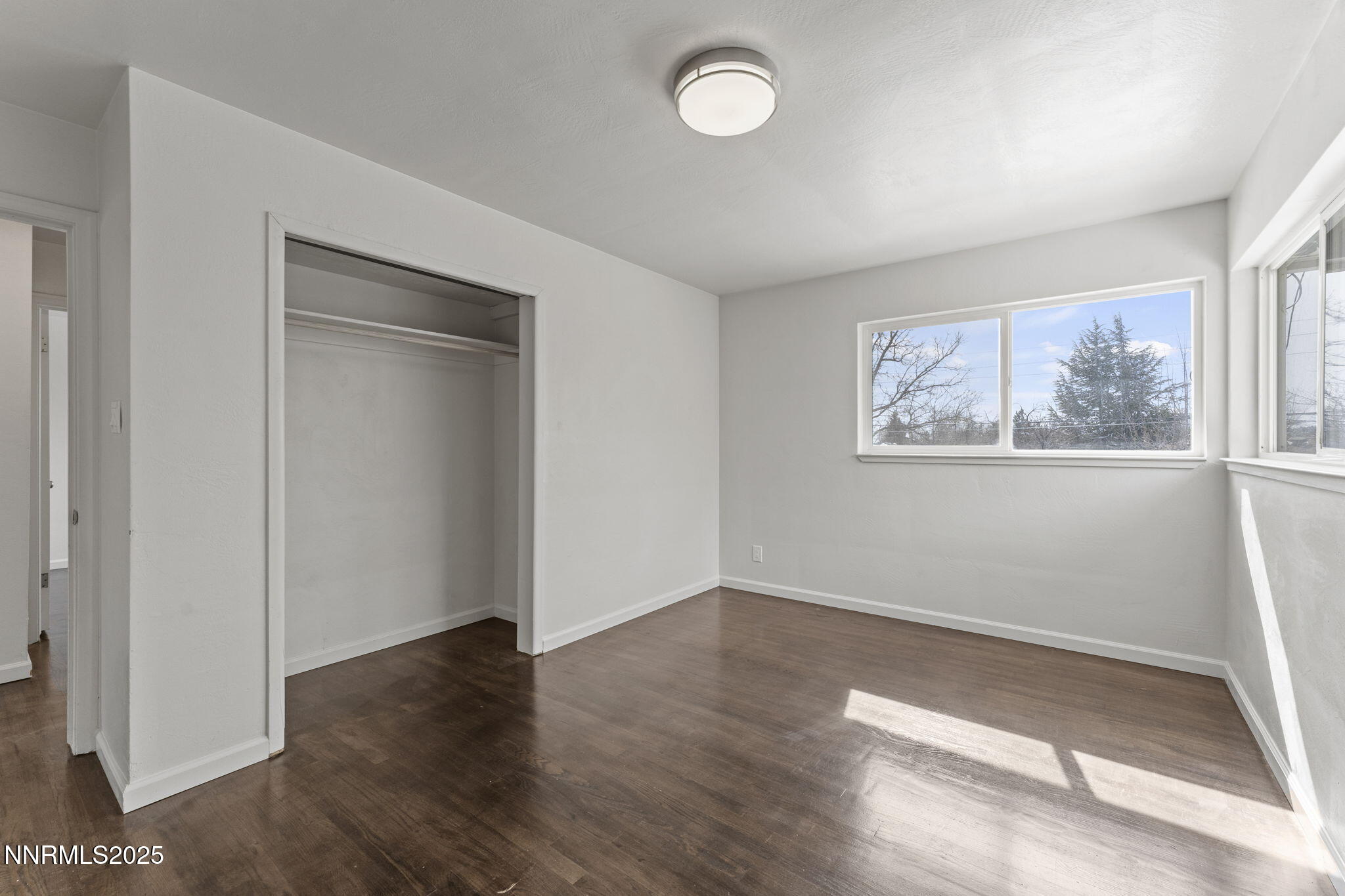 840 Brookfield Drive Reno, NV 89503 - Photo 21 of 42 an empty room with wooden floor and window