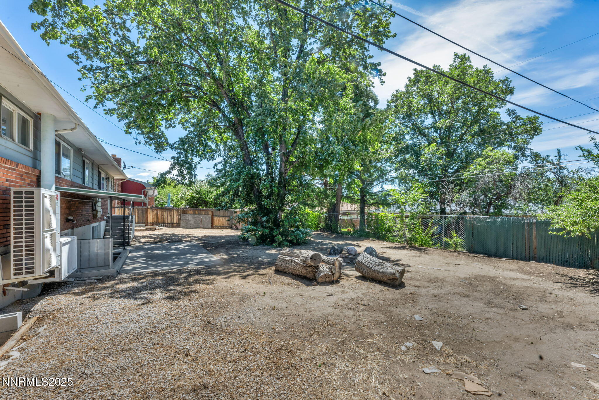 840 Brookfield Drive Reno, NV 89503 - Photo 39 of 42 a backyard of a house with fountain plants and large tree