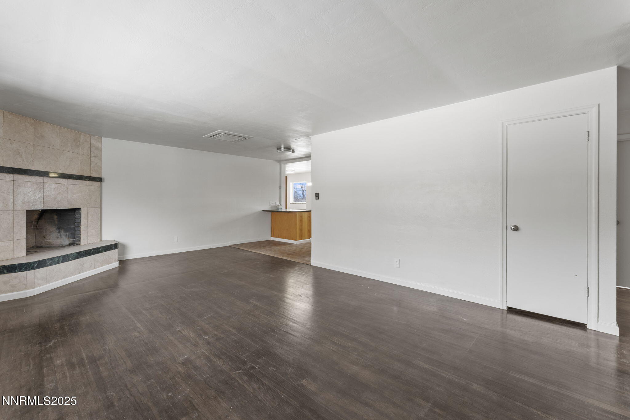 840 Brookfield Drive Reno, NV 89503 - Photo 7 of 42 a view of empty room with wooden floor and fireplace