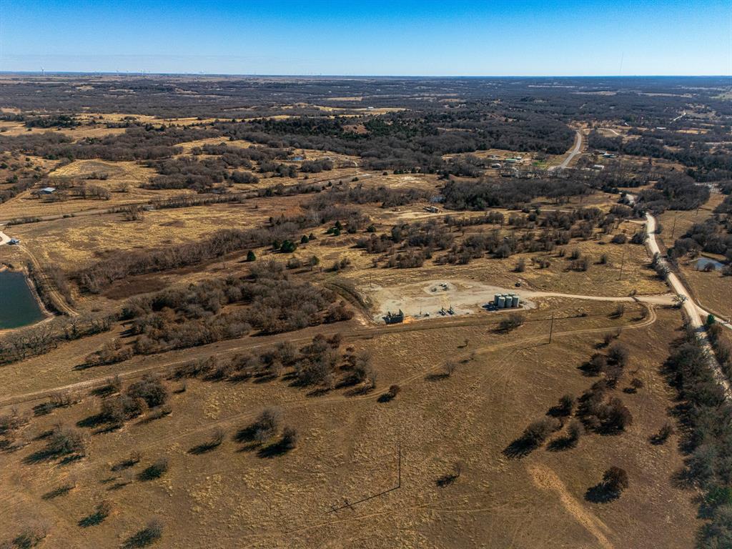 6 Lazy E Road St. Jo, TX 76265 - Photo 14 of 34 an aerial view of residential building and parking space