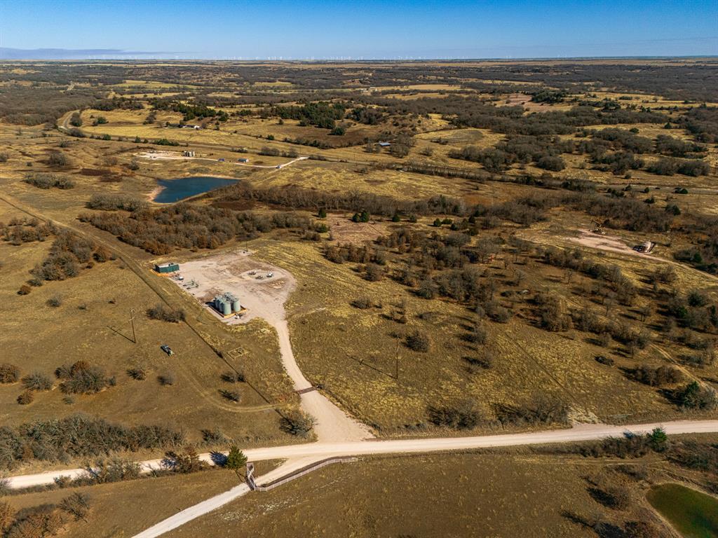 6 Lazy E Road St. Jo, TX 76265 - Photo 21 of 34 an aerial view of residential building and parking space