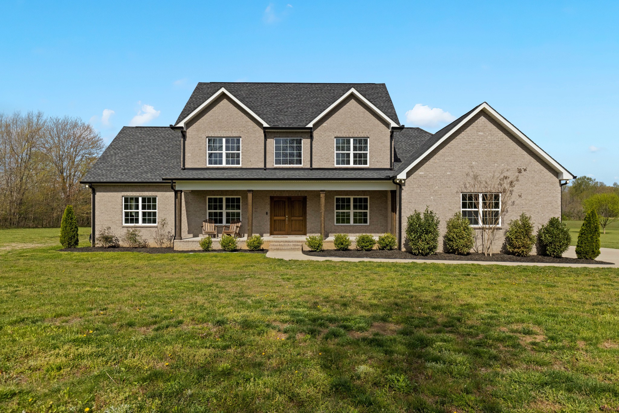 151 Halltown Road Cottontown, TN 37048 - Photo 1 of 1 a front view of a house with a garden and porch