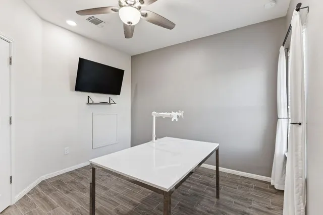 a view of a livingroom with a flat screen tv