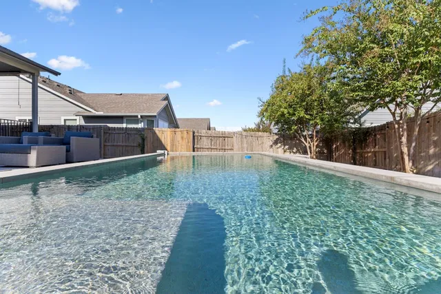 a view of a house with a swimming pool