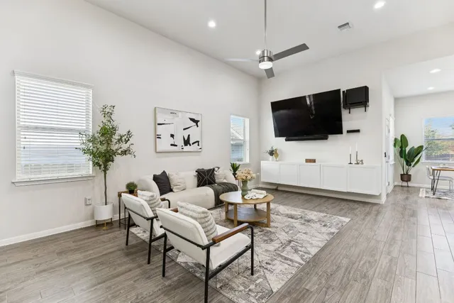 a living room with furniture and a flat screen tv