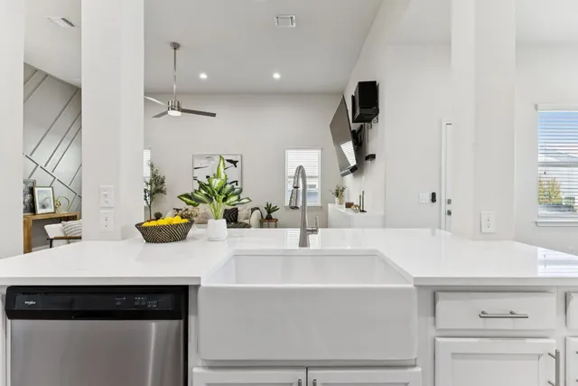 a kitchen with a sink and a refrigerator
