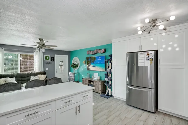 a kitchen with stainless steel appliances a stove sink and cabinets