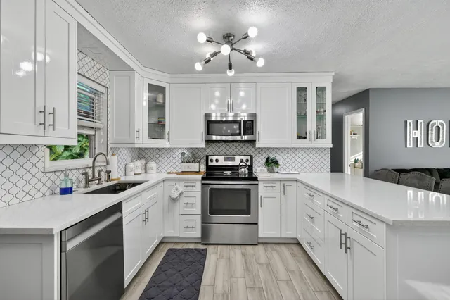 a living room with furniture and a bookshelf