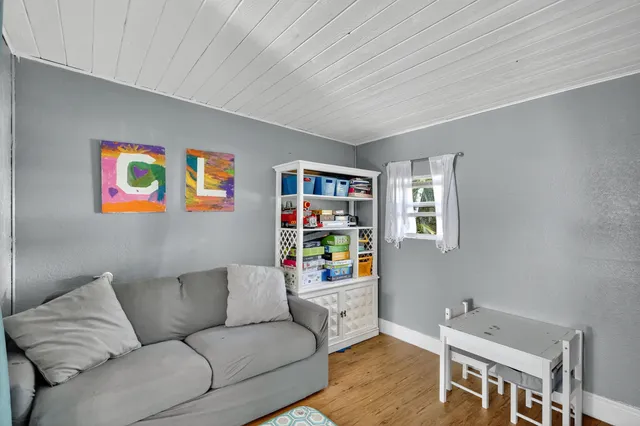 a view of a livingroom with furniture and window