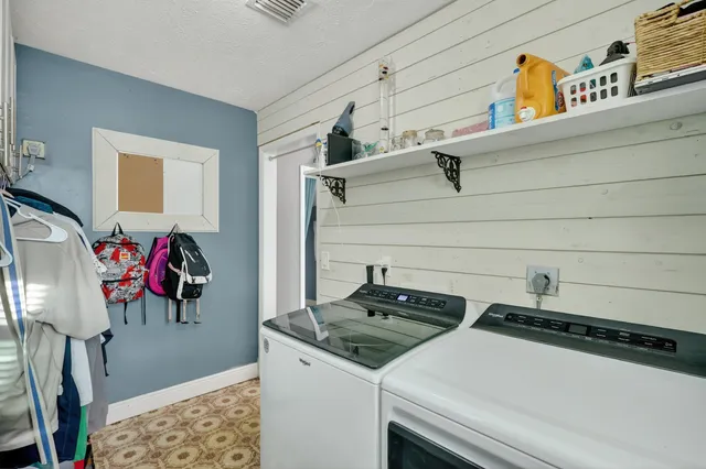 a view of a chairs and table in the patio