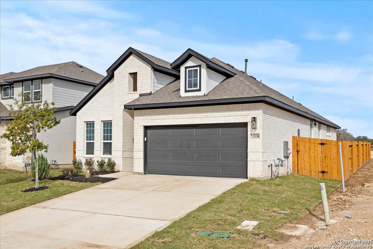 2134 Shepards Street Seguin, TX 78155 - Photo 2 of 24 a front view of a house with a yard and garage