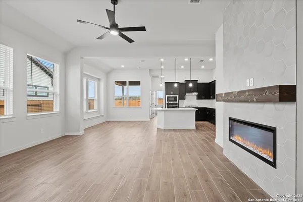 a view of a kitchen with a stove cabinets and wooden floor