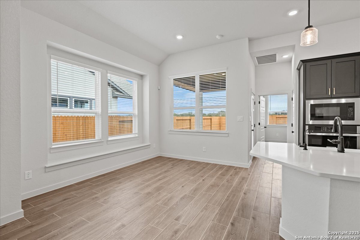 2134 Shepards Street Seguin, TX 78155 - Photo 8 of 24 an empty room with wooden floor and windows