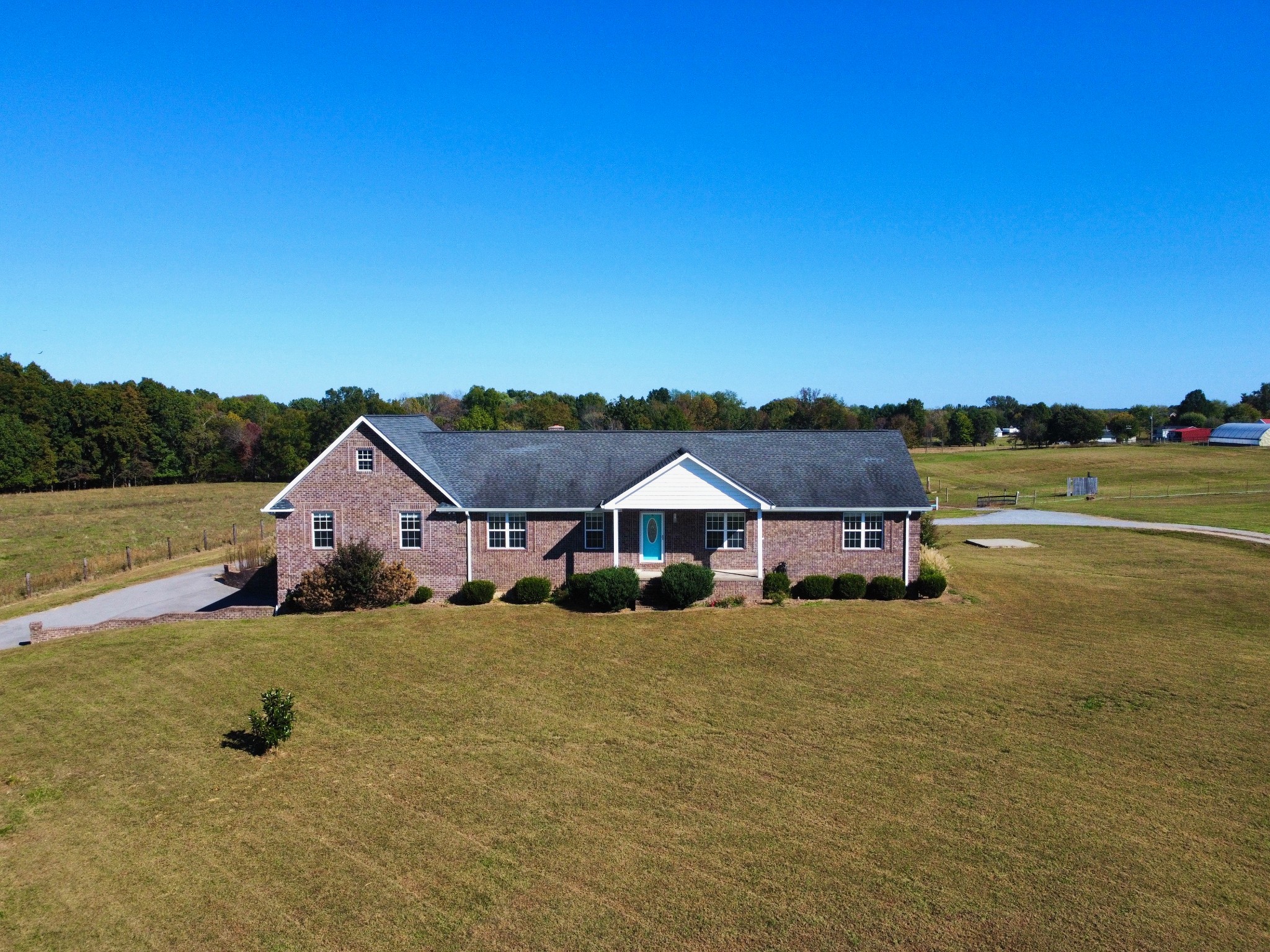 800 Williams Road Lafayette, TN 37083 - Photo 2 of 49 a house with trees in the background