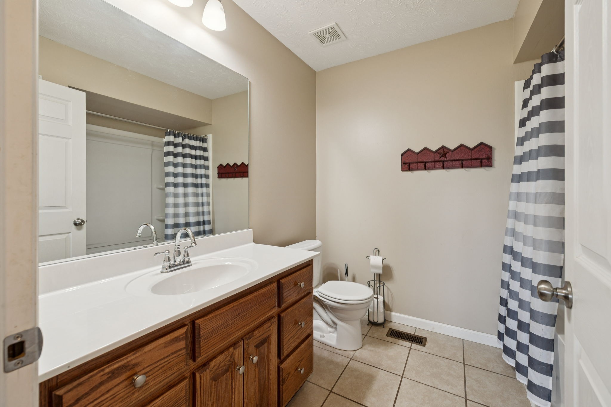 800 Williams Road Lafayette, TN 37083 - Photo 23 of 49 a bathroom with a sink a toilet and shower