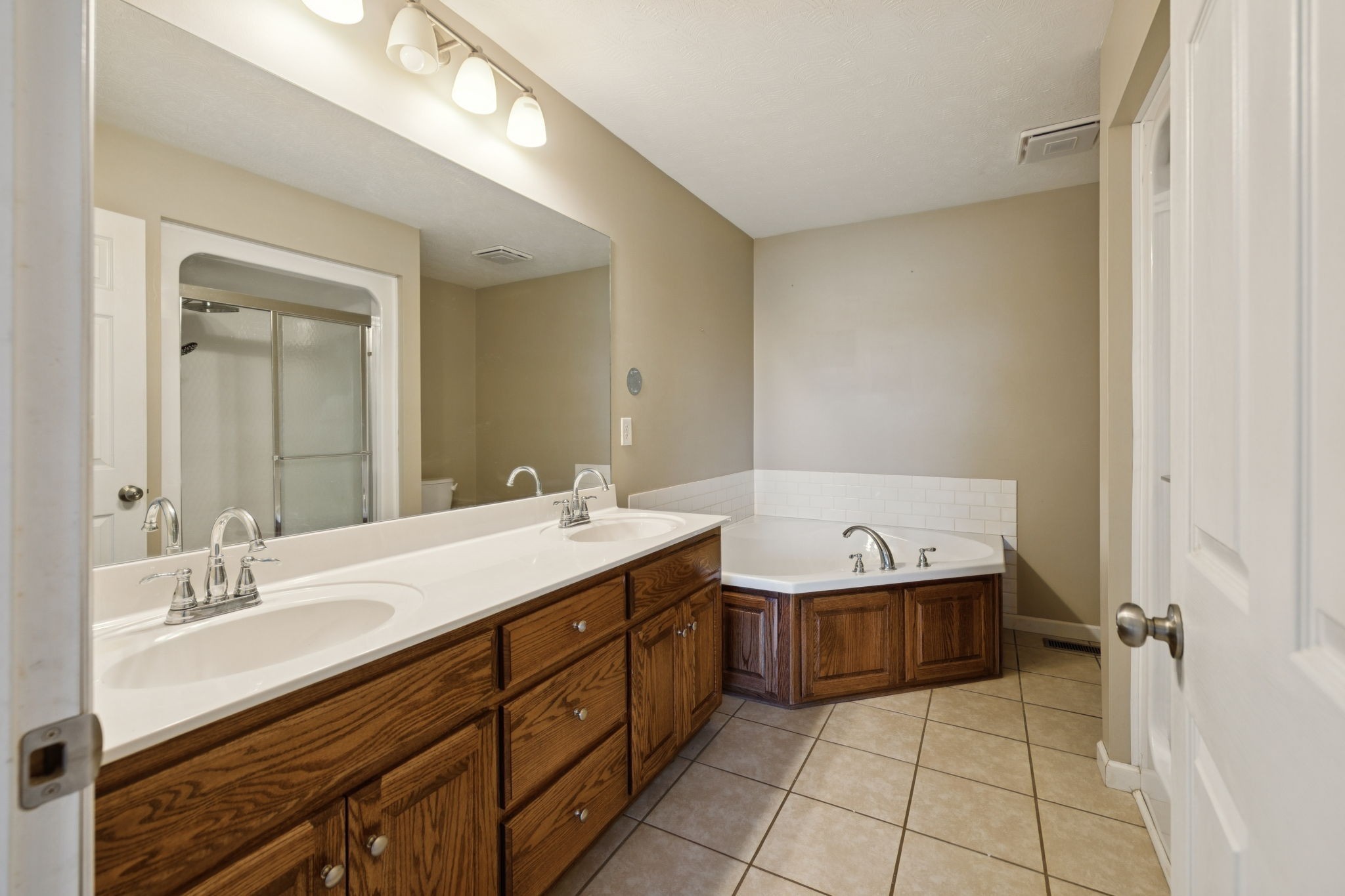 800 Williams Road Lafayette, TN 37083 - Photo 24 of 49 a bathroom with a sink double vanity and a mirror