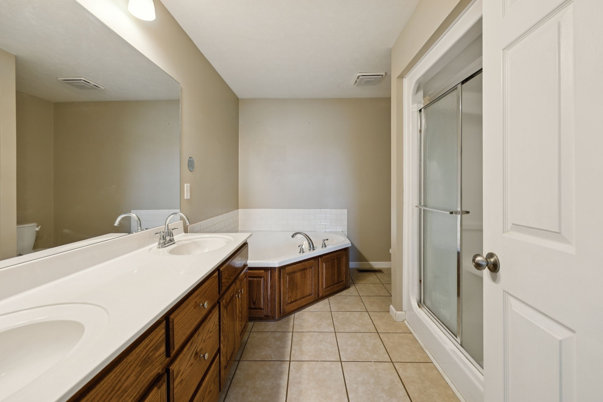 800 Williams Road Lafayette, TN 37083 - Photo 25 of 49 a bathroom with a granite countertop sink a mirror and a bathtub