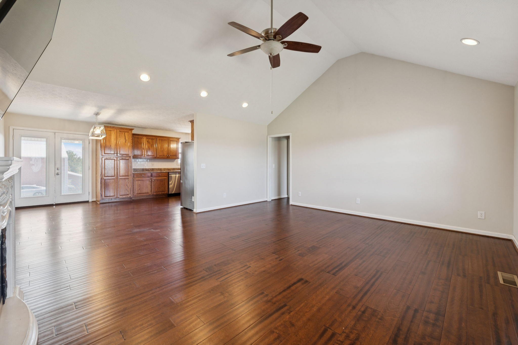 800 Williams Road Lafayette, TN 37083 - Photo 3 of 49 a view of an empty room with a window and wooden floor