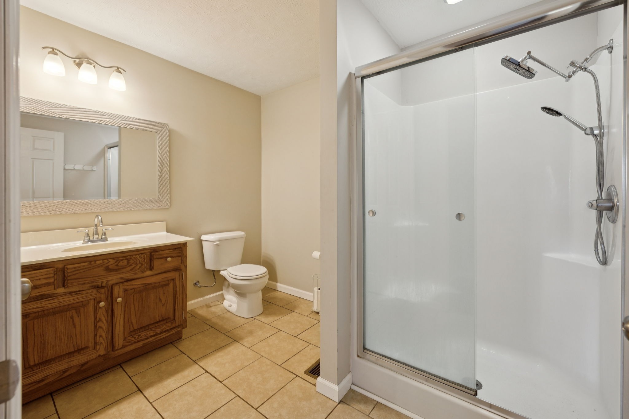 800 Williams Road Lafayette, TN 37083 - Photo 32 of 49 a bathroom with a granite countertop sink toilet and shower