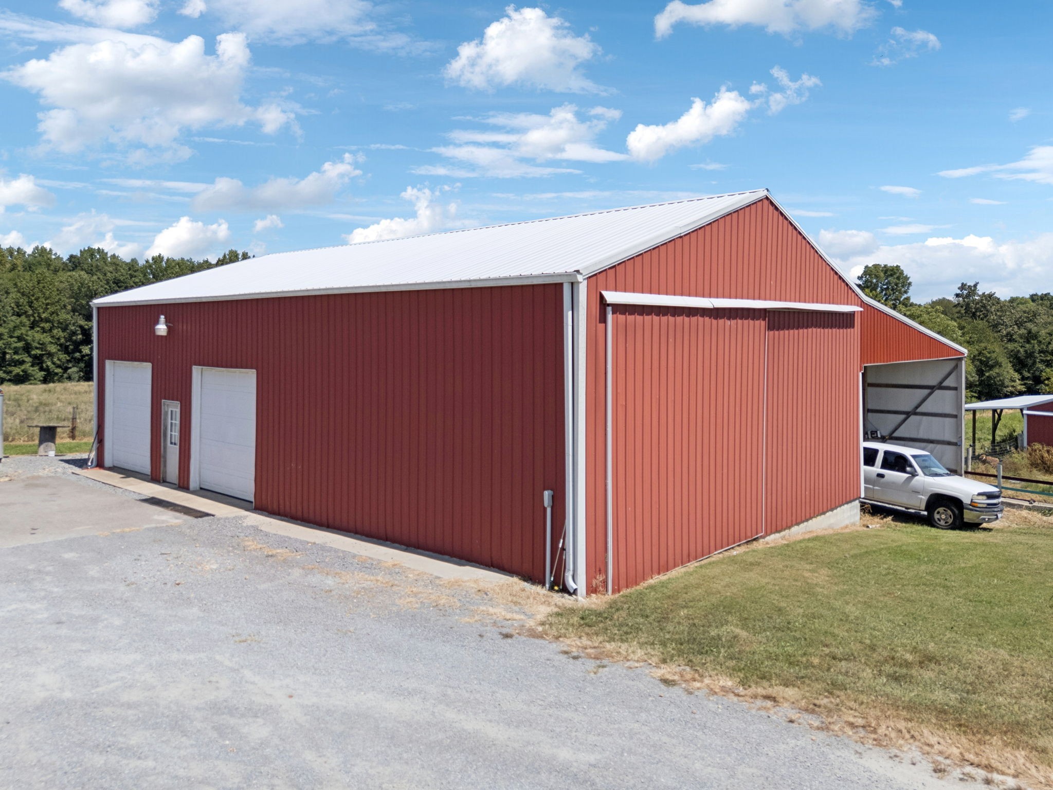 800 Williams Road Lafayette, TN 37083 - Photo 40 of 49 a backyard of a house with garage and a garage