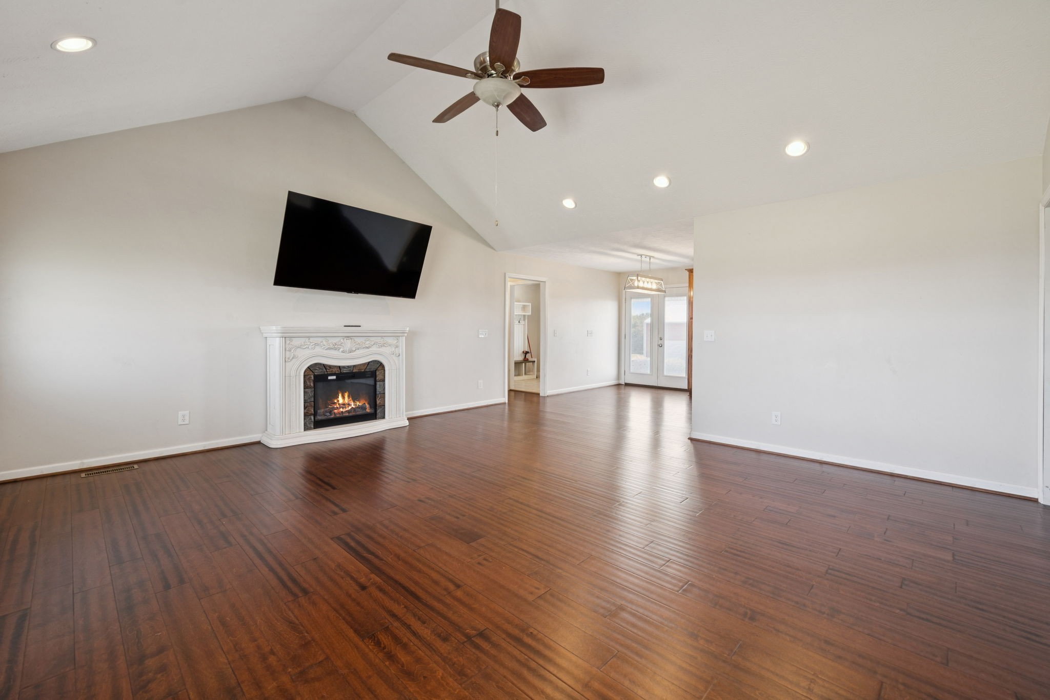 800 Williams Road Lafayette, TN 37083 - Photo 4 of 49 a view of an empty room with wooden floor and a fireplace